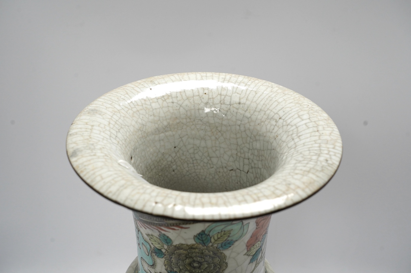A large Chinese famille rose crackle gu vase, early 20th century, 44.5cm high. Condition - has hole to base where possibly used as a lamp, rest of lamp good